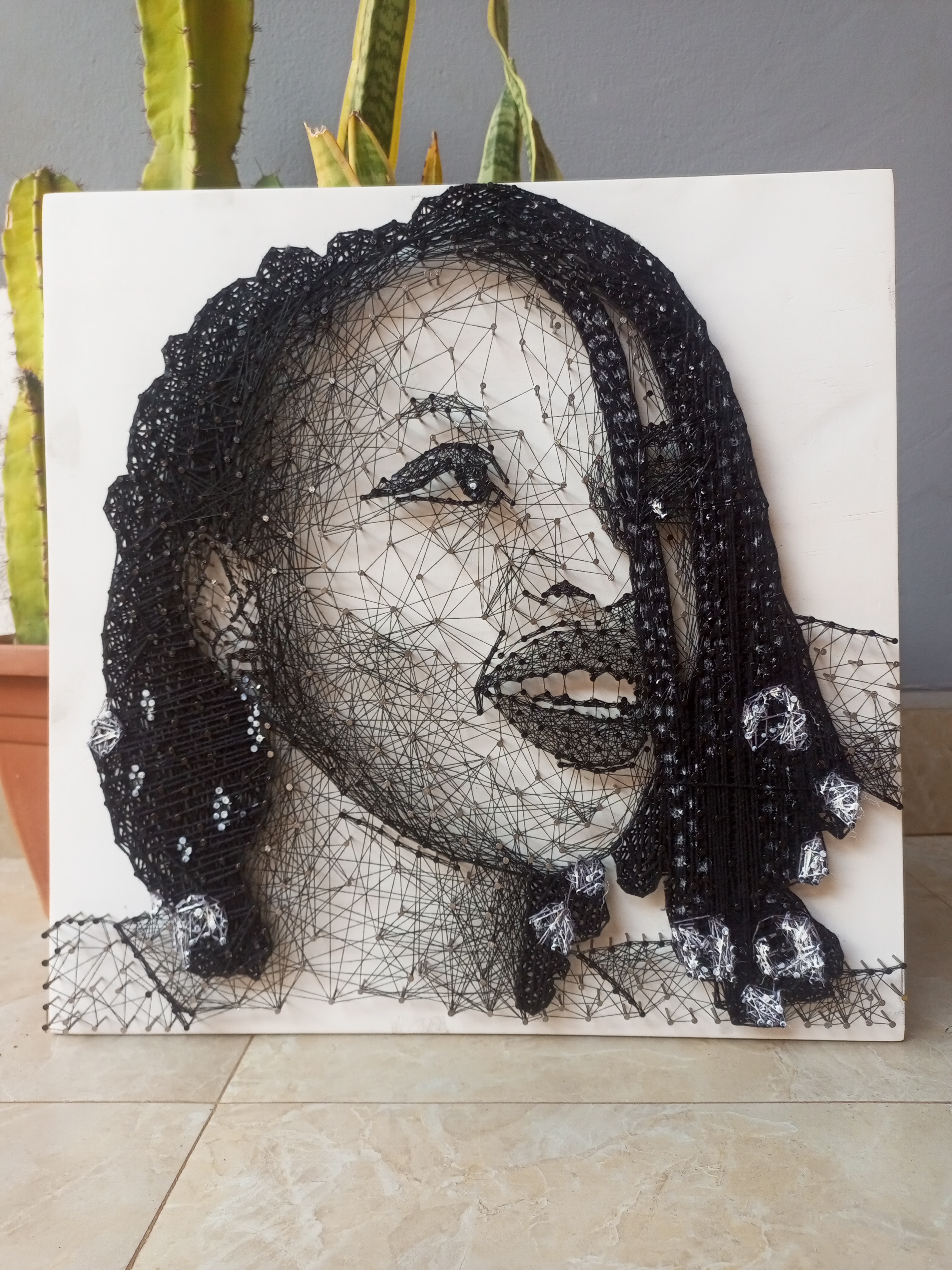 Portrait of a lady in string art